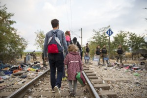 Refugees and migrants cross the border from Greece into Macedonia, near the village of Idomeni, Greece, 24 August 2015.